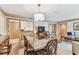 Open living and dining space featuring wood flooring, and neutral decor at 36750 Us 19 N # 08204, Palm Harbor, FL 34684