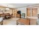 Living and dining space featuring wood flooring, a TV and neutral decor at 36750 Us 19 N # 08204, Palm Harbor, FL 34684