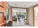 Inviting living room featuring wood floors, comfortable seating, and a large window with a view of the outdoor terrace at 36750 Us 19 N # 08204, Palm Harbor, FL 34684