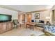 Living and dining space featuring wood flooring, a TV and neutral decor at 36750 Us 19 N # 08204, Palm Harbor, FL 34684