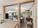 Open living room featuring a view to the dining room and kitchen, with hardwood floors at 36750 Us 19 N # 08204, Palm Harbor, FL 34684