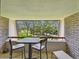 Balcony view of the golf course with seating for two and a lounge chair at 36750 Us 19 N # 15309, Palm Harbor, FL 34684