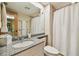 Bright bathroom featuring granite counters, modern fixtures, and a shower-tub combo at 36750 Us 19 N # 15309, Palm Harbor, FL 34684