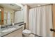 Bathroom featuring granite counters, modern fixtures, and a shower-tub combo at 36750 Us 19 N # 15309, Palm Harbor, FL 34684