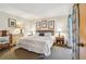 Cozy bedroom featuring plush bed, dresser, decorative pillows, and natural light at 36750 Us 19 N # 15309, Palm Harbor, FL 34684