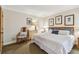 Cozy bedroom featuring plush bed, dresser, decorative pillows, and natural light at 36750 Us 19 N # 15309, Palm Harbor, FL 34684