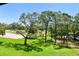 Scenic view of the golf course and mature trees from the property at 36750 Us 19 N # 15309, Palm Harbor, FL 34684