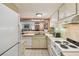 Traditional kitchen featuring an open concept and white appliances at 36750 Us 19 N # 15309, Palm Harbor, FL 34684