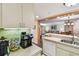 Open kitchen with stainless steel sink, breakfast bar, and appliances at 36750 Us 19 N # 15309, Palm Harbor, FL 34684