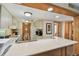 Bright kitchen featuring a breakfast bar, white appliances, and wood trim at 36750 Us 19 N # 15309, Palm Harbor, FL 34684