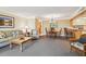 Living area with dining area, breakfast bar, sofa, chairs, and coffee table at 36750 Us 19 N # 15309, Palm Harbor, FL 34684