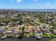 Aerial view of home, waterfront location, neighborhood streets, and distance to the ocean at 3932 Shore Acres Ne Blvd, St Petersburg, FL 33703