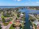 Aerial view of a waterfront home, showcasing the neighborhood, canal access, and nearby bay views at 3932 Shore Acres Ne Blvd, St Petersburg, FL 33703