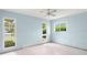 Bright and airy bedroom boasts multiple windows and abundant natural light at 3932 Shore Acres Ne Blvd, St Petersburg, FL 33703