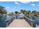 Private wooden dock extending into the canal at 3932 Shore Acres Ne Blvd, St Petersburg, FL 33703