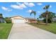 Charming home with a large driveway, attached garage, and well-manicured landscaping at 3932 Shore Acres Ne Blvd, St Petersburg, FL 33703