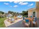 Outdoor patio set with waterfront views and lounge furniture at 3932 Shore Acres Ne Blvd, St Petersburg, FL 33703