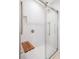 Modern shower with glass door, built-in seat, and recessed shelf at 3932 Shore Acres Ne Blvd, St Petersburg, FL 33703