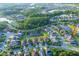 Aerial community view with lush landscaping, multiple ponds and beautiful homes at 3952 Aldea Way, Wesley Chapel, FL 33543