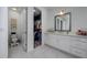Bathroom and closet featuring a toilet, vanity, and an open walk-in closet at 3952 Aldea Way, Wesley Chapel, FL 33543