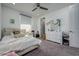 Bedroom featuring a neutral color palette, carpet flooring, and a view of a white dresser at 3952 Aldea Way, Wesley Chapel, FL 33543