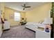 Bright bedroom with carpet flooring, and complemented by modern furnishings and decor at 3952 Aldea Way, Wesley Chapel, FL 33543