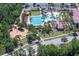 Expansive community pool area features multiple pools, water slide, playground, picnic area, and parking at 3952 Aldea Way, Wesley Chapel, FL 33543