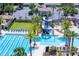 Community pool offers a water slide, lap lanes, sundeck, and a covered picnic area for residents to enjoy at 3952 Aldea Way, Wesley Chapel, FL 33543