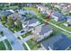 Beautiful two-story home with a brick driveway near a scenic pond at 3952 Aldea Way, Wesley Chapel, FL 33543
