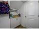 Hallway storage with built-in shelving is an efficient use of space at 3952 Aldea Way, Wesley Chapel, FL 33543