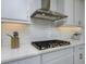 Well-lit kitchen with stainless steel range hood and white subway tile backsplash at 3952 Aldea Way, Wesley Chapel, FL 33543