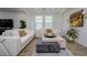 Comfortable living room with modern decor and abundant natural light at 3952 Aldea Way, Wesley Chapel, FL 33543