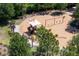 Community playground in a natural setting features swings, climbing structure, shaded picnic area and other amenities at 3952 Aldea Way, Wesley Chapel, FL 33543