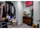 Organized walk-in closet with ample storage space and shelving units at 3952 Aldea Way, Wesley Chapel, FL 33543