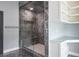 Contemporary bathroom featuring a glass enclosed shower with marble tiling and integrated seating at 4012 Wellington Pkwy, Palm Harbor, FL 34685