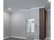 Neutral bedroom featuring grey carpet, modern fixtures, and a convenient closet space at 4012 Wellington Pkwy, Palm Harbor, FL 34685