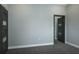 Bedroom showcasing a modern door and carpet flooring at 4012 Wellington Pkwy, Palm Harbor, FL 34685