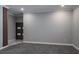 Cozy bedroom with neutral carpet, modern paneling, and convenient closet access at 4012 Wellington Pkwy, Palm Harbor, FL 34685