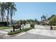 Gated entrance with manicured landscaping marking the entry to The Reserve community with luxurious homes at 4012 Wellington Pkwy, Palm Harbor, FL 34685