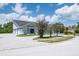 This stunning home offers an attached three-car garage and a circular driveway, great for entertaining guests at 4012 Wellington Pkwy, Palm Harbor, FL 34685