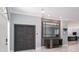 Foyer view features decorative mirror, modern doors and marble floors at 4012 Wellington Pkwy, Palm Harbor, FL 34685