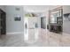 Bright foyer boasts marble floors, modern doors, and decorative transom window at 4012 Wellington Pkwy, Palm Harbor, FL 34685