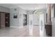 Bright foyer boasts marble floors, modern doors, and decorative transom window at 4012 Wellington Pkwy, Palm Harbor, FL 34685