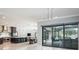 Open concept with marble floors that connect the kitchen, dining, and living area at 4012 Wellington Pkwy, Palm Harbor, FL 34685