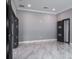 Bright living room with marble floors and modern doors at 4012 Wellington Pkwy, Palm Harbor, FL 34685