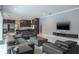 Spacious living room with contemporary design, flowing into the kitchen and dining areas at 4012 Wellington Pkwy, Palm Harbor, FL 34685
