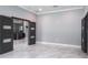 Bright living room with marble floors and modern doors at 4012 Wellington Pkwy, Palm Harbor, FL 34685