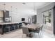 Open living space combining the kitchen, dining, and living areas for seamless modern living at 4012 Wellington Pkwy, Palm Harbor, FL 34685
