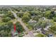 Aerial view of a home nestled among mature trees in a quiet residential neighborhood at 4324 S Clark Ave, Tampa, FL 33611