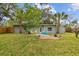 Spacious backyard with a brick patio and inviting outdoor seating area at 4324 S Clark Ave, Tampa, FL 33611